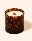 Tortoiseshell-patterned candle on a white background