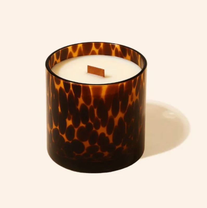 Tortoiseshell-patterned candle on a white background