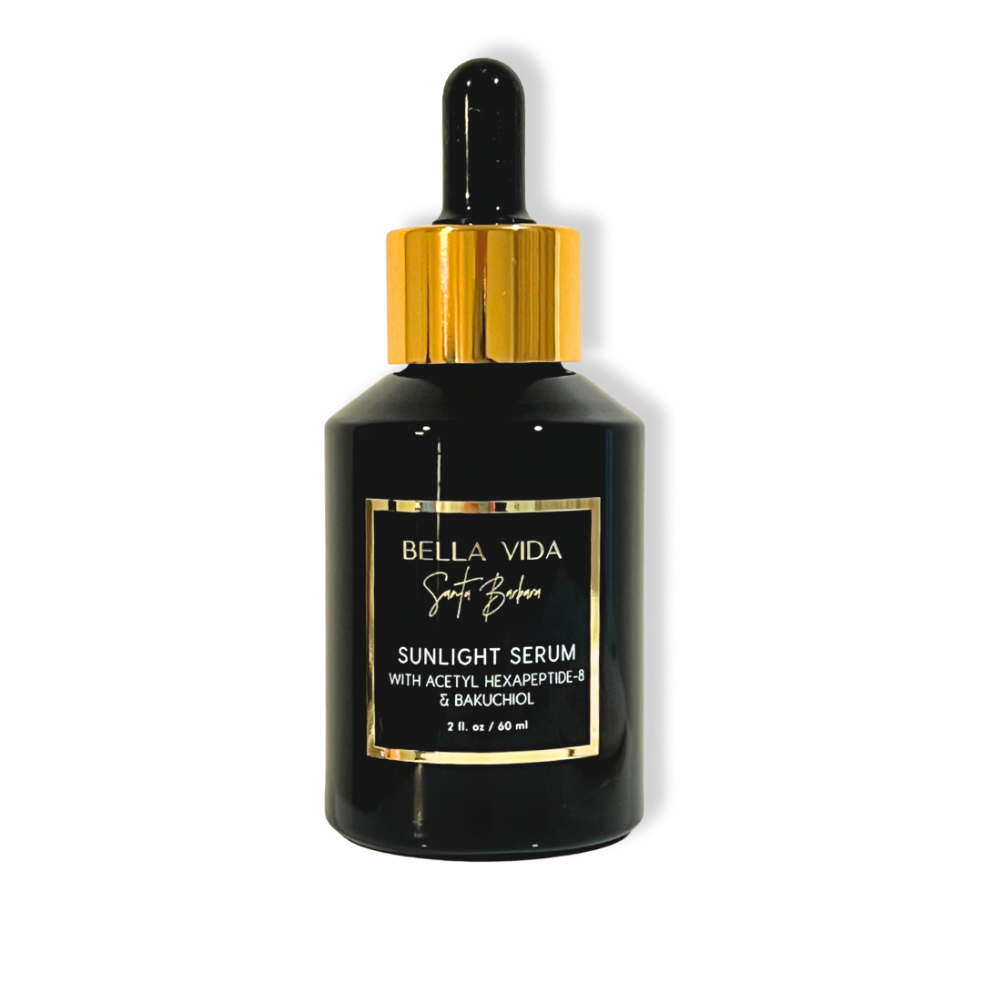 Black serum bottle with gold cap and label on a white background Bella Vida Santa Barbara Sunlight Serum